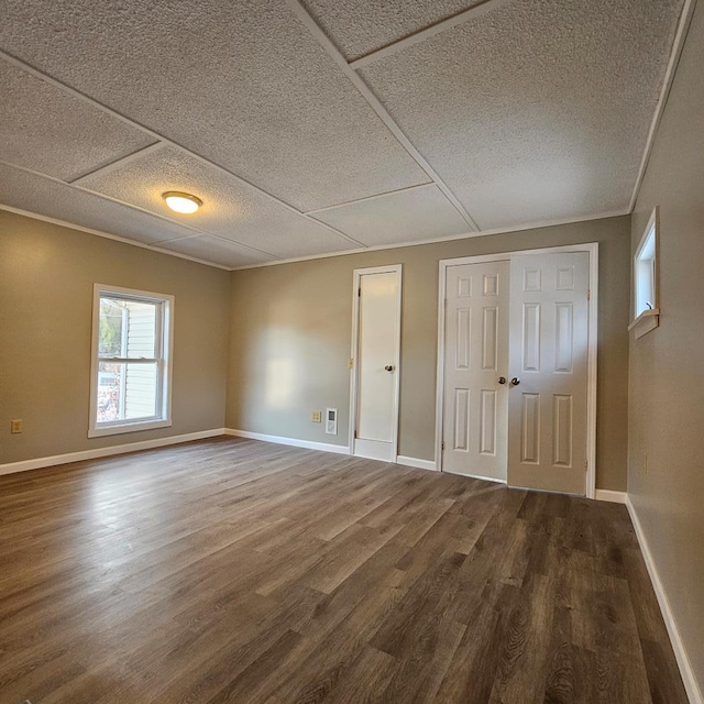 unfurnished bedroom with hardwood / wood-style floors