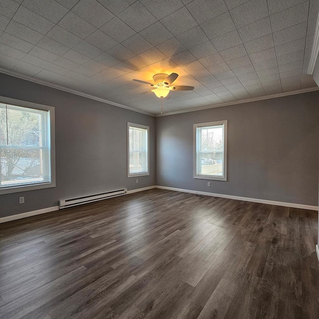 empty room with a baseboard heating unit, dark wood-type flooring, and ornamental molding