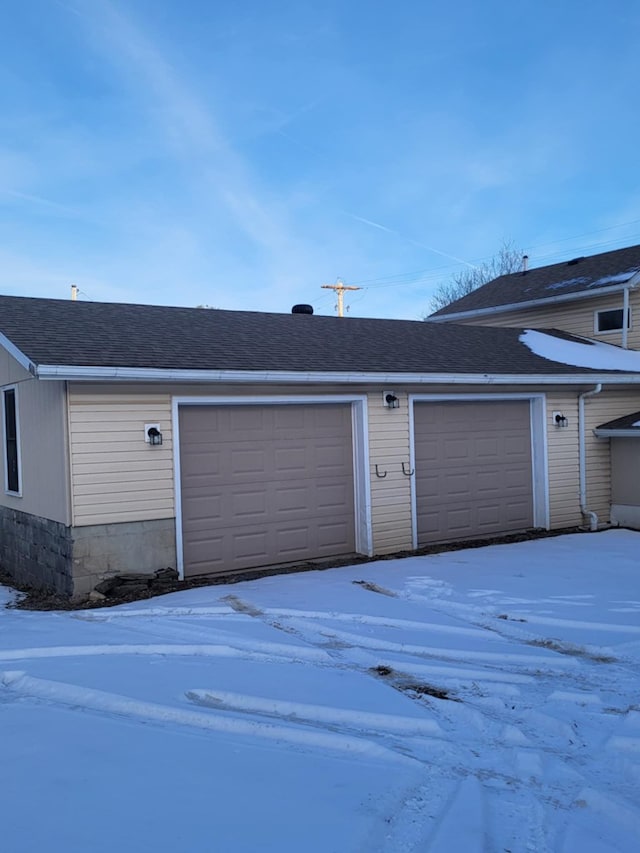 view of snow covered garage