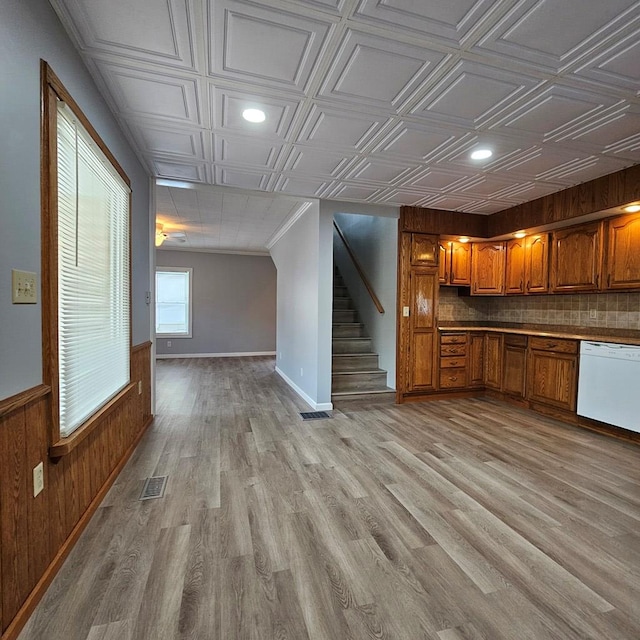 kitchen featuring light wood-type flooring and white dishwasher