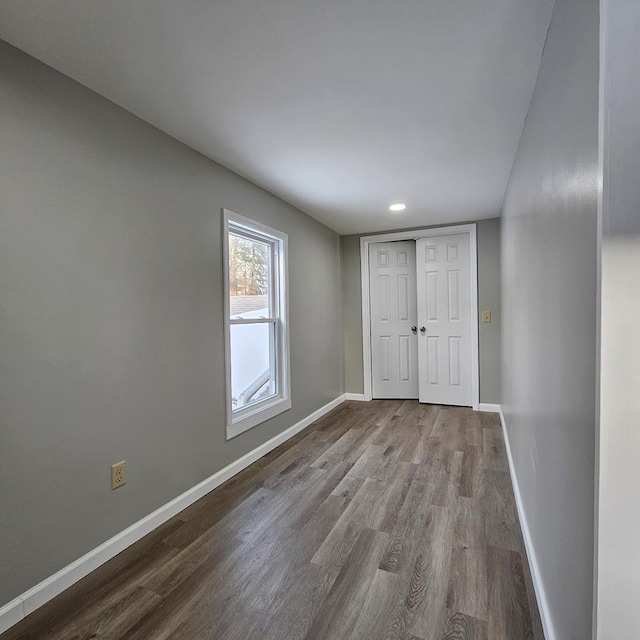 empty room featuring hardwood / wood-style flooring