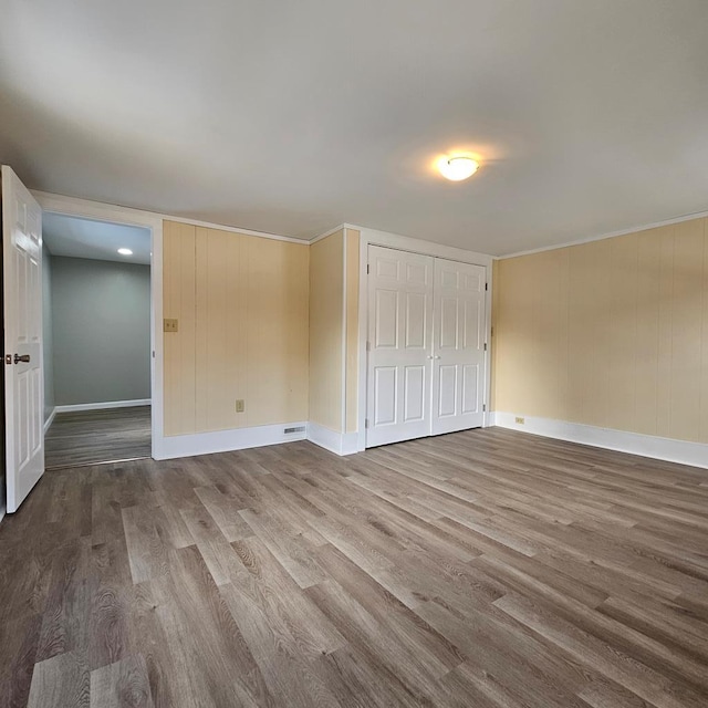 spare room featuring hardwood / wood-style flooring