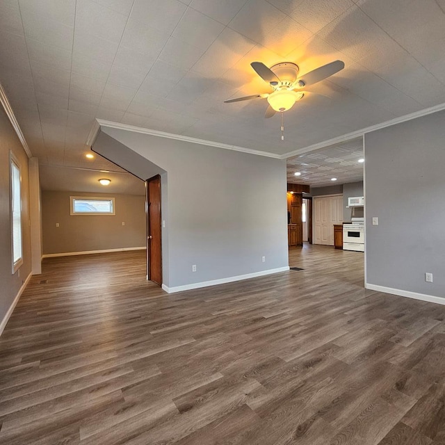 unfurnished living room with crown molding and dark wood-type flooring