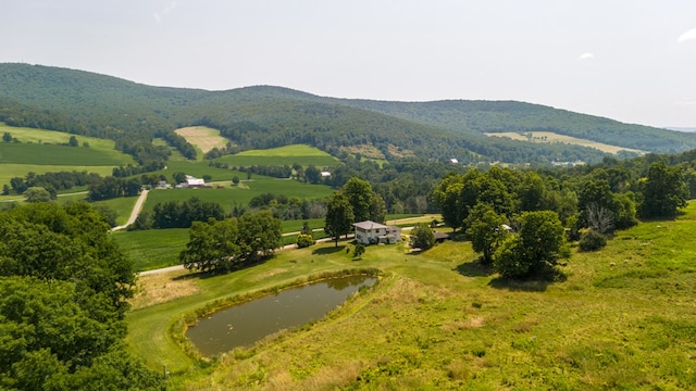 aerial view with a water and mountain view and a rural view