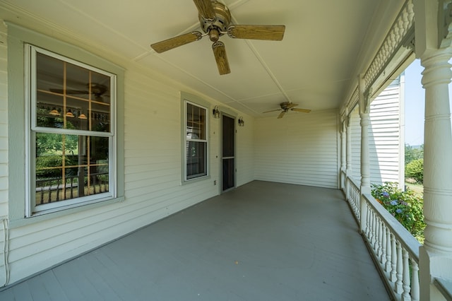 view of patio with ceiling fan and a porch