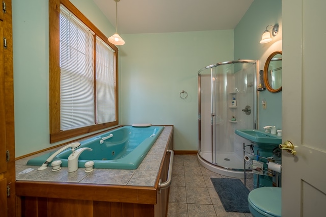 bathroom with tile patterned flooring, toilet, and an enclosed shower