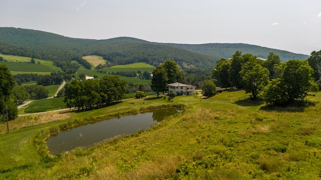 view of mountain feature featuring a rural view and a water view