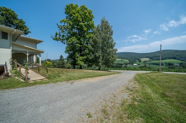 view of street with a mountain view and a rural view