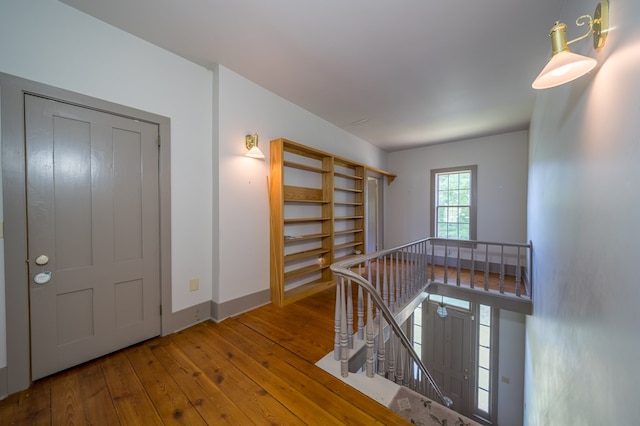 hall with wood-type flooring