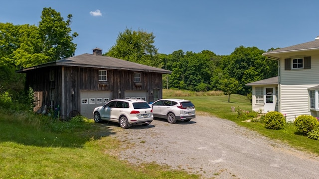 exterior space with a front yard and a garage