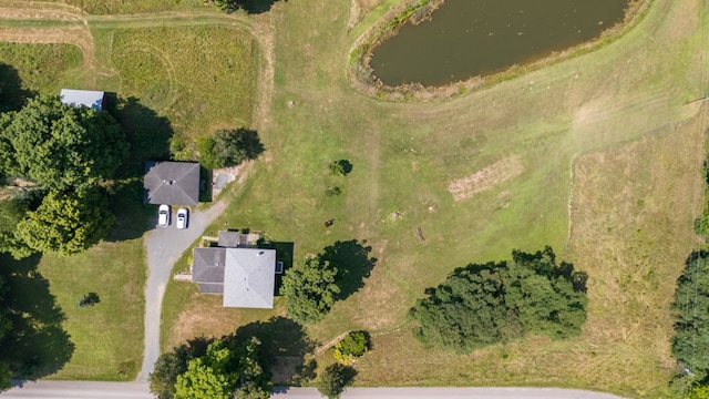 birds eye view of property with a water view and a rural view