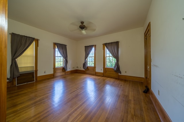 bonus room featuring ceiling fan and dark hardwood / wood-style flooring