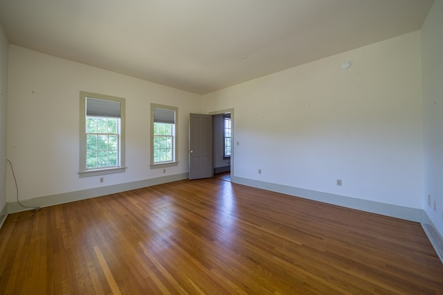 unfurnished room featuring wood-type flooring