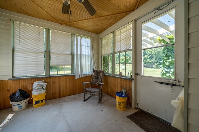 sunroom featuring ceiling fan and wooden ceiling