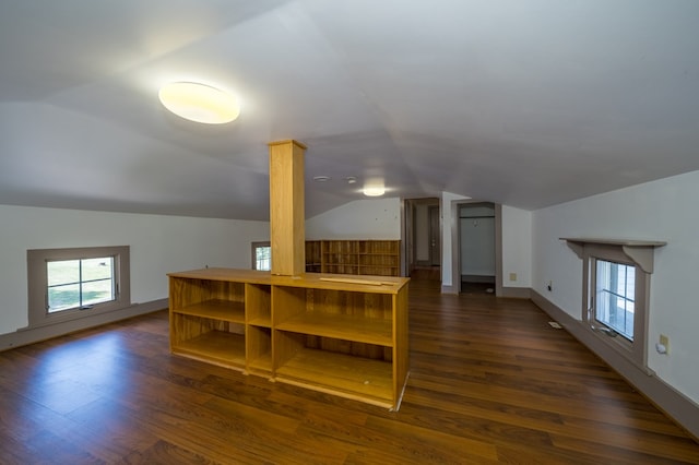 bonus room featuring dark hardwood / wood-style floors and lofted ceiling