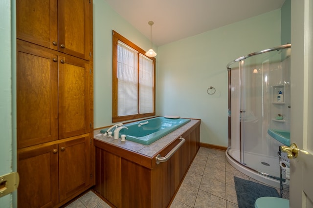 bathroom with tile patterned floors and a shower with door