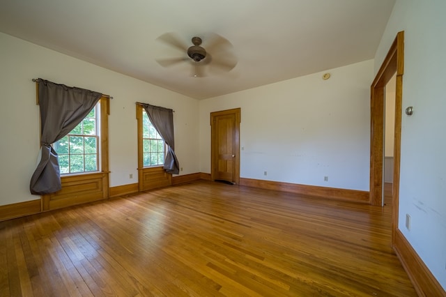 spare room with ceiling fan and wood-type flooring