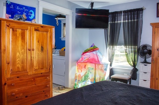 bedroom featuring washer / dryer