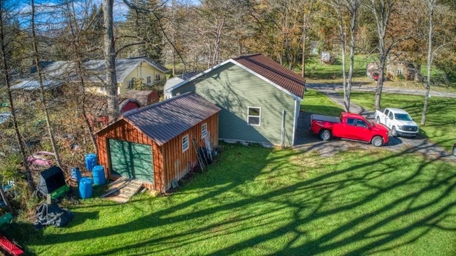 exterior space with a garage and a yard