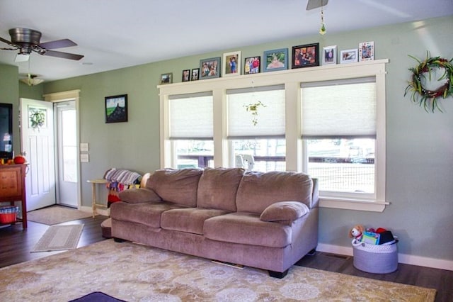 living room featuring hardwood / wood-style floors, ceiling fan, and a wealth of natural light