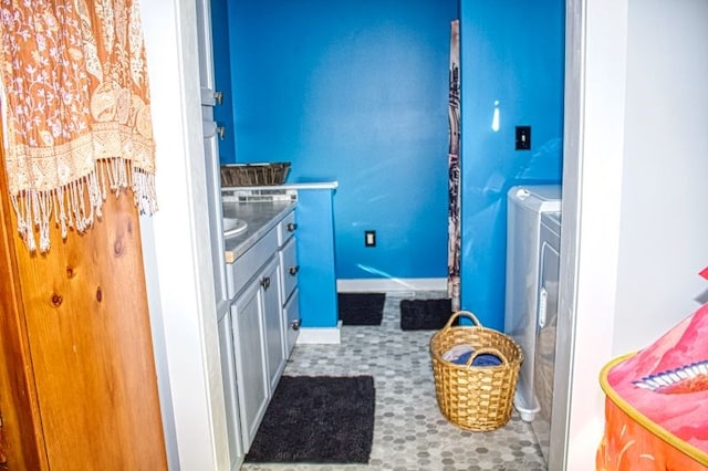 laundry area with cabinets and independent washer and dryer