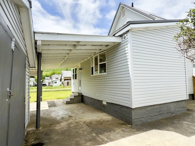 113 1st St, Shinglehouse, PA 16748 - view of home's exterior featuring entry steps, crawl space, and a carport