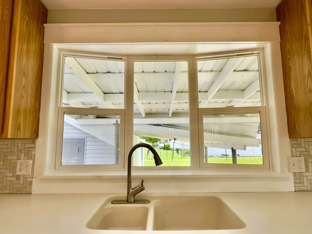 113 1st St, Shinglehouse, PA 16748 - kitchen view of a sink, decorative backsplash, and light countertops
