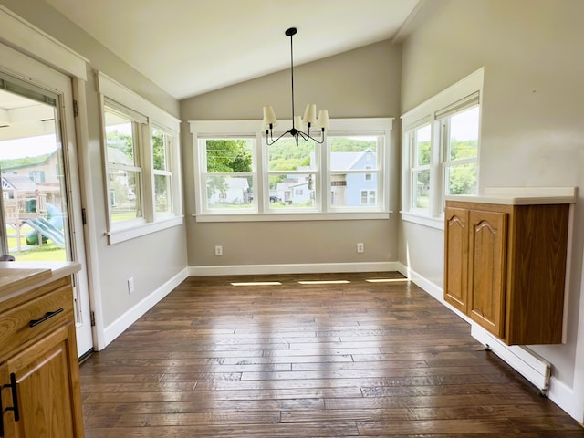 113 1st St, Shinglehouse, PA 16748 - unfurnished dining area featuring a chandelier, dark wood-type flooring, lofted ceiling, and baseboards
