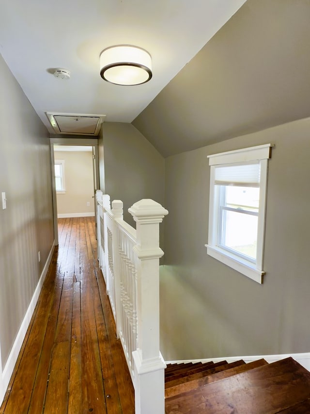 113 1st St, Shinglehouse, PA 16748 - hall featuring an upstairs landing, hardwood / wood-style floors, attic access, vaulted ceiling, and baseboards