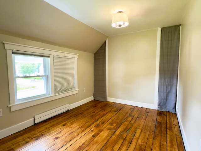 113 1st St, Shinglehouse, PA 16748 - bonus room featuring baseboard heating, lofted ceiling, hardwood / wood-style floors, and baseboards