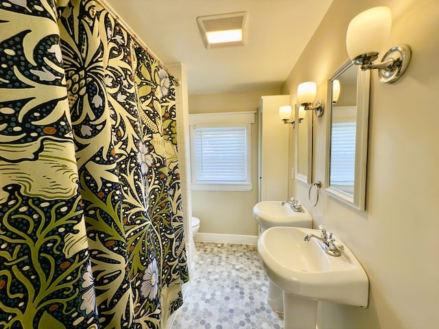 113 1st St, Shinglehouse, PA 16748 - bathroom with toilet, baseboards, a sink, and a shower with shower curtain