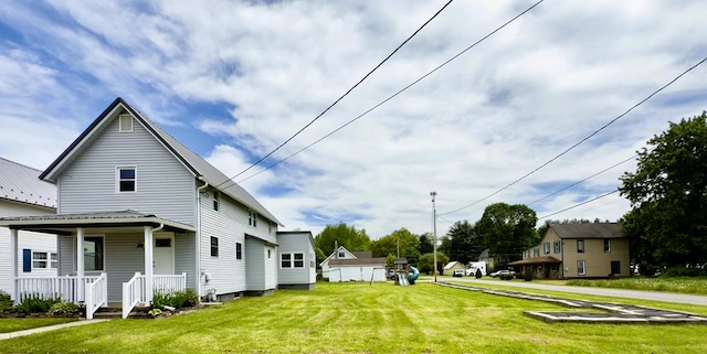 113 1st St, Shinglehouse, PA 16748 - view of side of home with a porch and a lawn