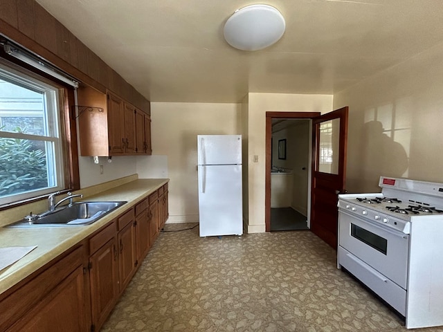 kitchen with white appliances and sink