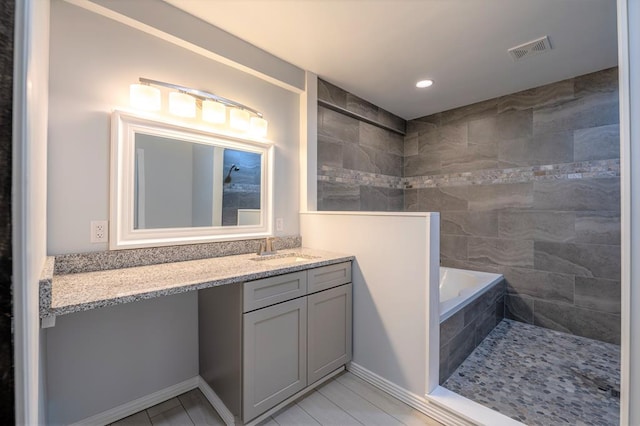 17899 Rte 6, Towanda, PA 18848 - full bathroom with vanity, tiled tub, recessed lighting, and tile patterned floors
