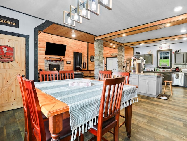 17899 Rte 6, Towanda, PA 18848 - dining space featuring ornate columns, wood finished floors, a stone fireplace, and recessed lighting