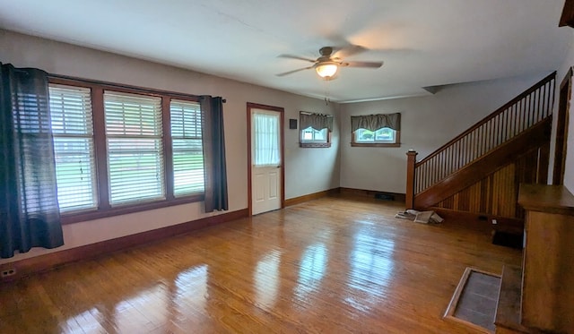 foyer entrance with ceiling fan and hardwood / wood-style flooring