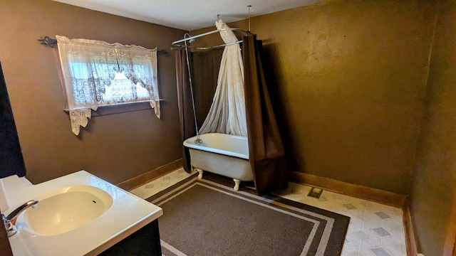 bathroom with vanity and independent shower and bath