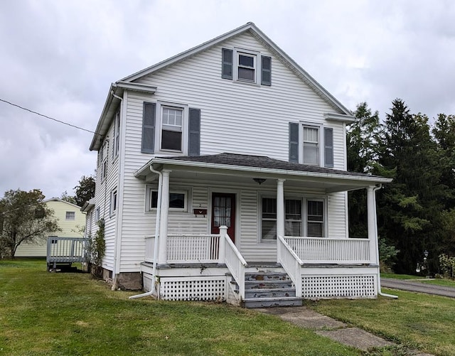 view of front of house with a porch and a front yard