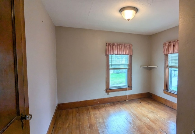 unfurnished room featuring light hardwood / wood-style floors