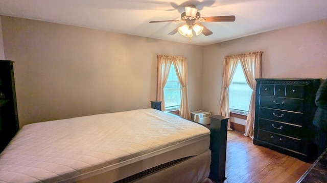 bedroom featuring hardwood / wood-style floors and ceiling fan