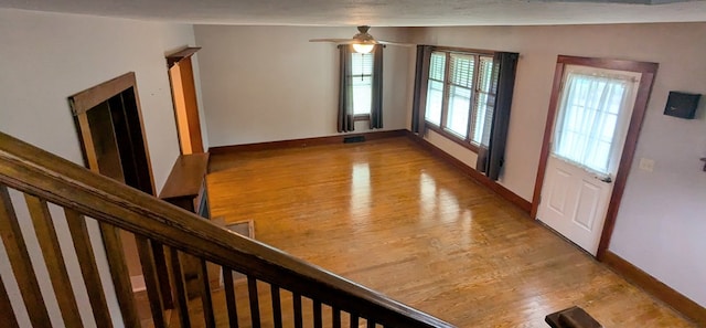 interior space with light hardwood / wood-style floors and ceiling fan