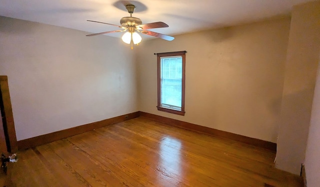 spare room with ceiling fan and hardwood / wood-style flooring