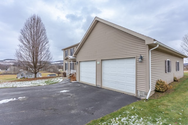 view of property exterior with a garage