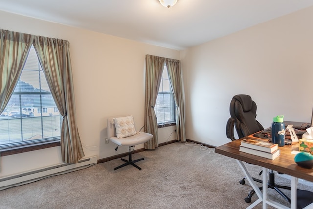 office space featuring baseboard heating and light colored carpet