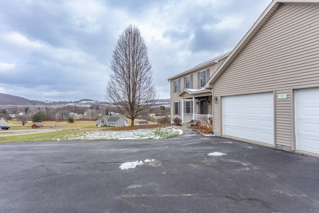 exterior space featuring a mountain view and a garage