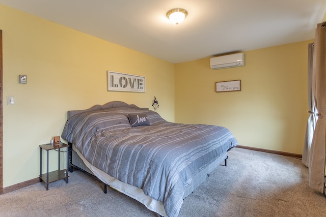 bedroom featuring a wall mounted air conditioner and carpet