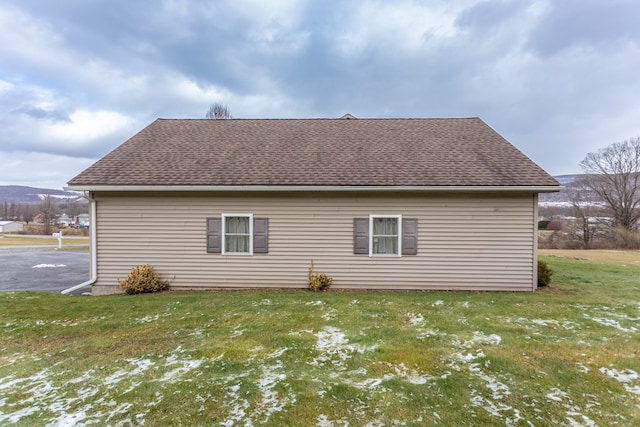 view of home's exterior with a yard