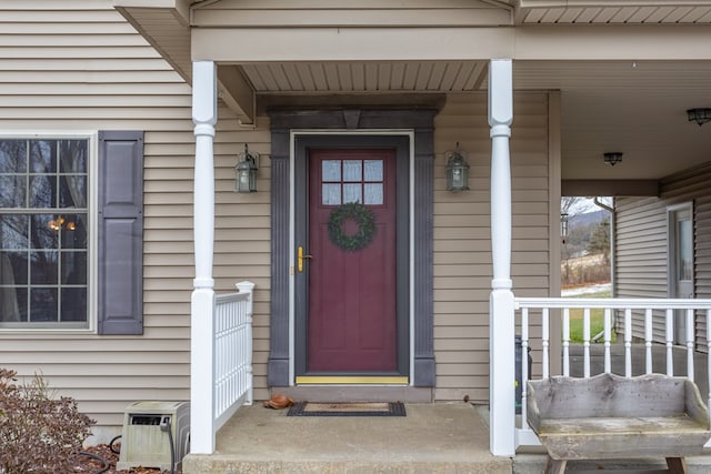 entrance to property featuring covered porch