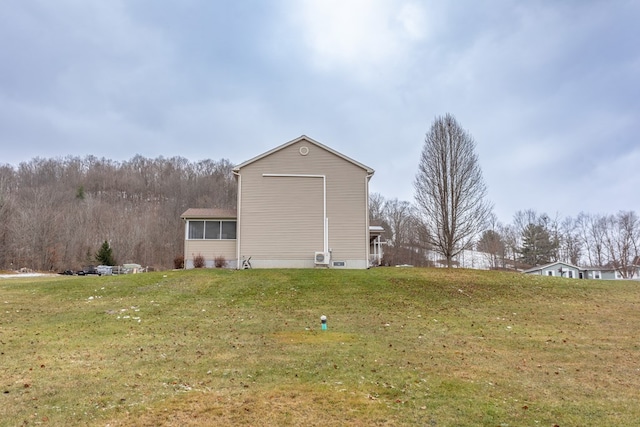 view of home's exterior with a yard