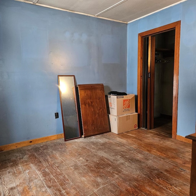 empty room with hardwood / wood-style flooring